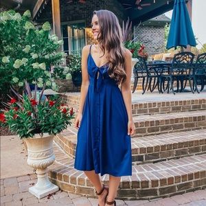 Small, Navy Midi Dress with buttons and tie in front.